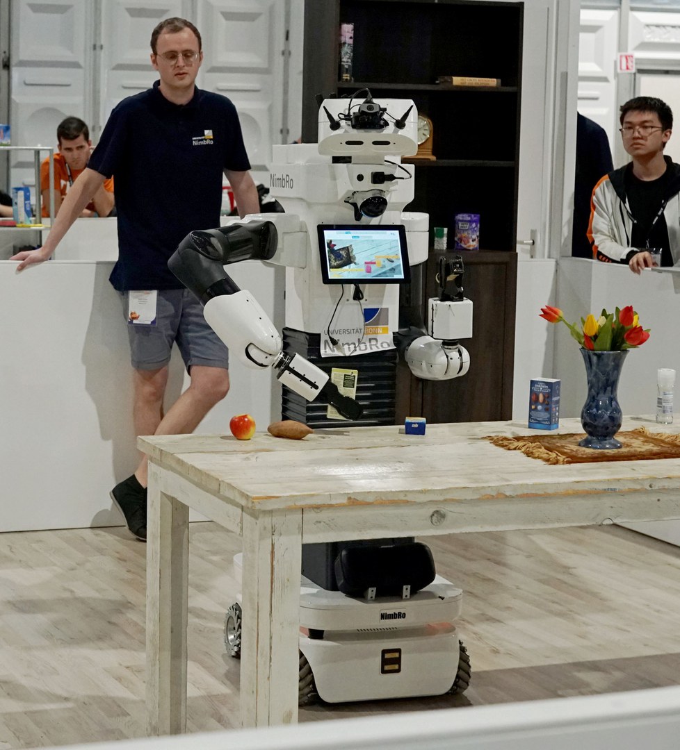 University of Bonn´s service robot grasping an ingredient.